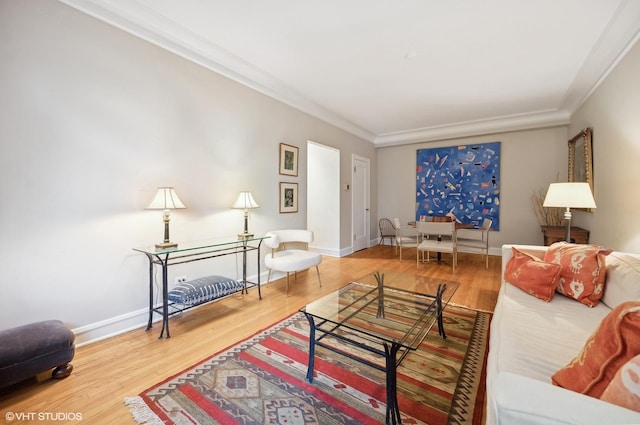 living room featuring hardwood / wood-style floors and ornamental molding