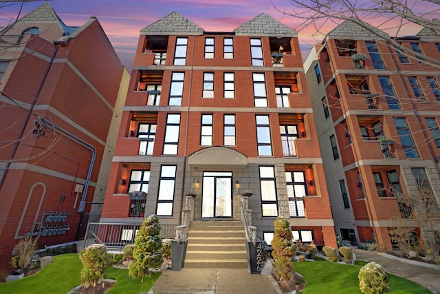 view of outdoor building at dusk