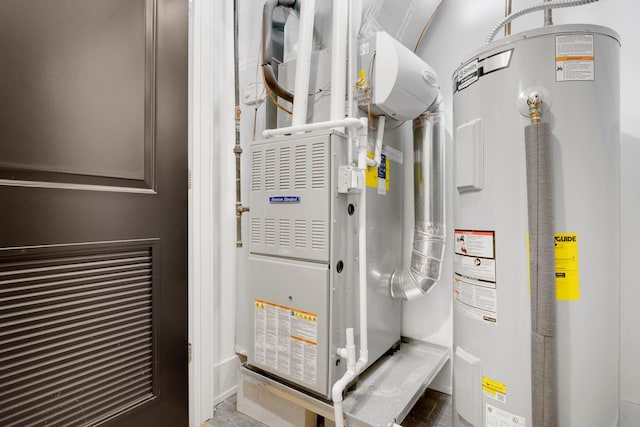 utility room with electric water heater and heating unit