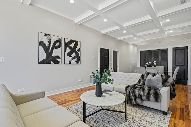 living room with beam ceiling, hardwood / wood-style flooring, and coffered ceiling