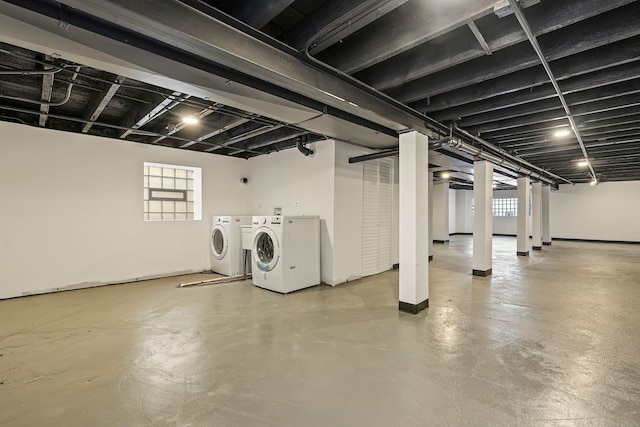 basement featuring a healthy amount of sunlight and washer and clothes dryer