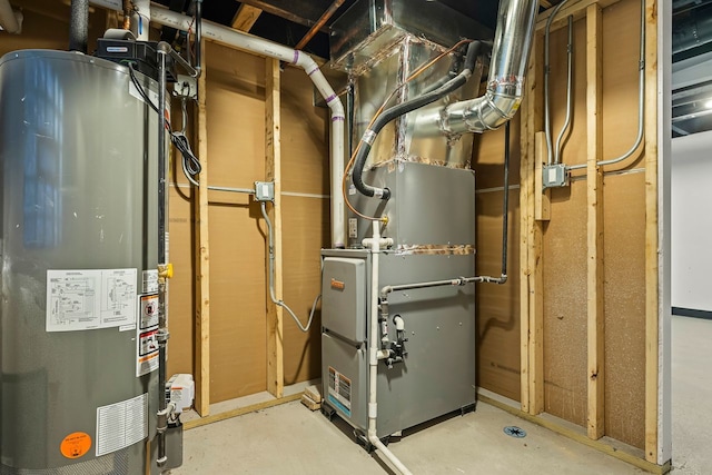 utility room with heating unit and gas water heater