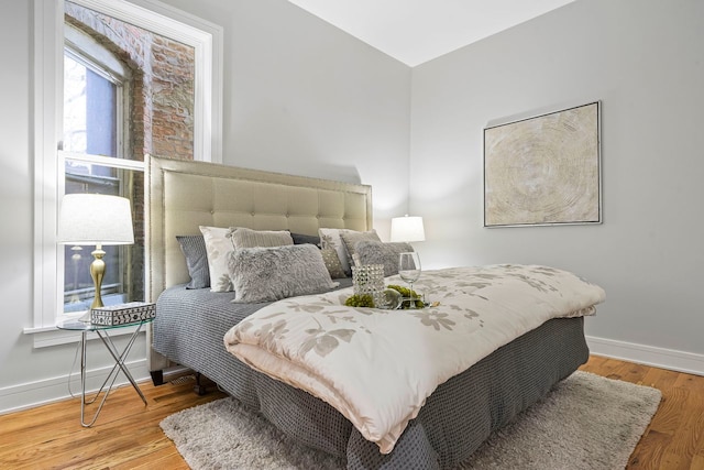 bedroom with light hardwood / wood-style flooring