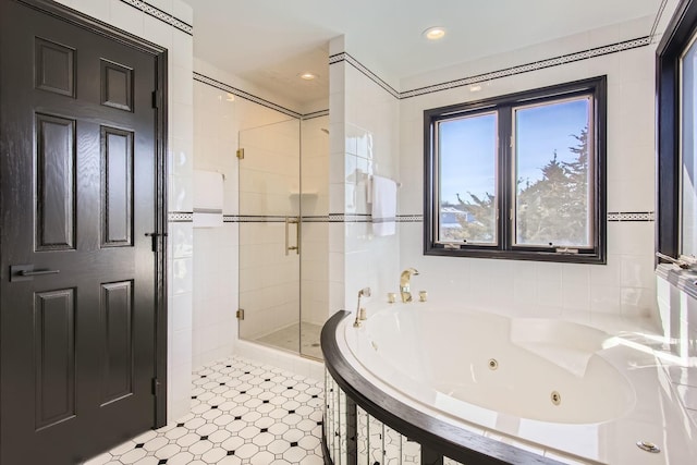 bathroom featuring separate shower and tub