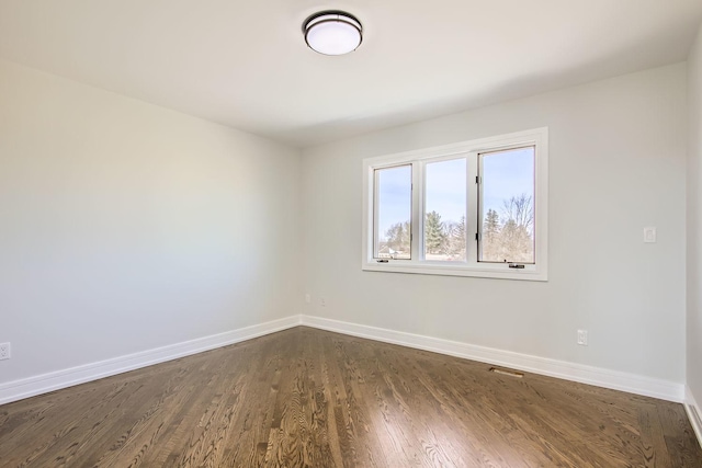 empty room featuring dark hardwood / wood-style floors