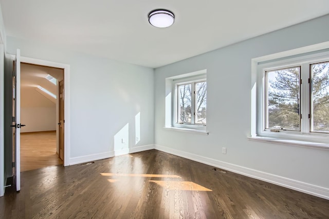 empty room featuring dark hardwood / wood-style floors