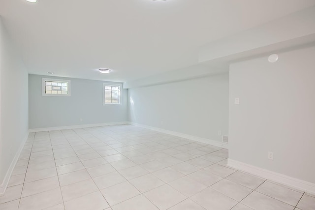 basement featuring light tile patterned floors