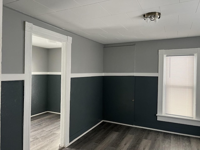 spare room featuring dark hardwood / wood-style floors