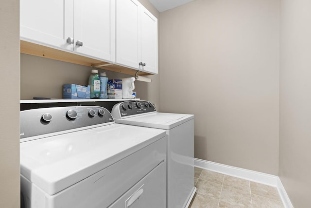 laundry area featuring independent washer and dryer and cabinets