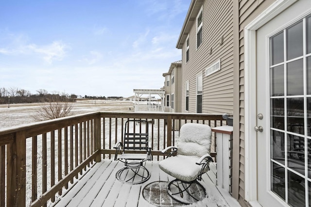 view of snow covered deck