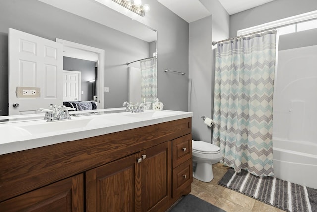 full bathroom with vanity, shower / bath combination with curtain, and toilet