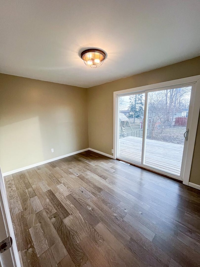 unfurnished room featuring wood-type flooring