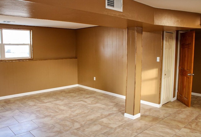 basement with wooden walls