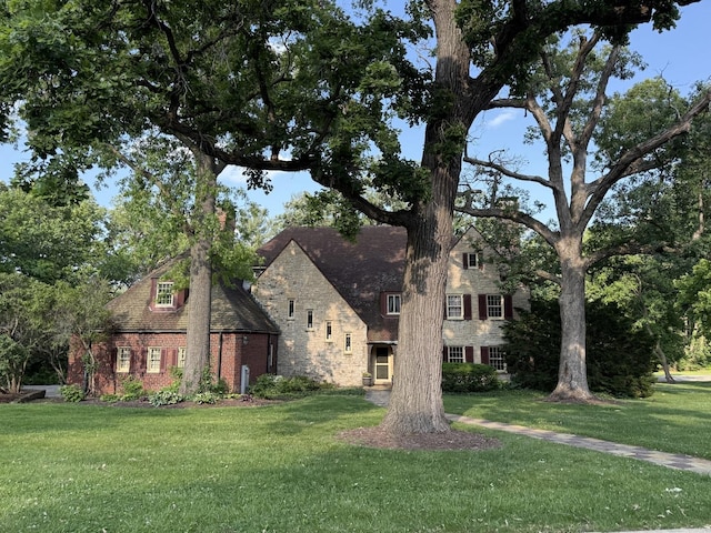 2221 Twin Oak Rd, Peru, IL 61354 - view of front of property with a front lawn, stone siding, and brick siding