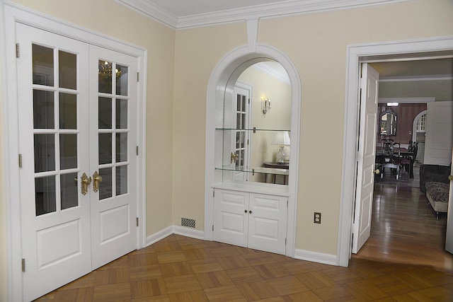 2221 Twin Oak Rd, Peru, IL 61354 - doorway with french doors, arched walkways, crown molding, and baseboards