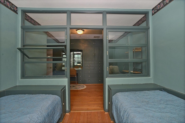 bedroom with wood finished floors