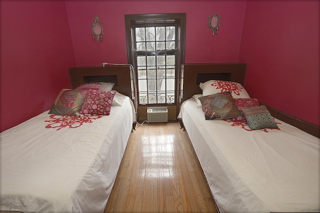 2221 Twin Oak Rd, Peru, IL 61354 - bedroom featuring hardwood / wood-style flooring and a wall unit AC