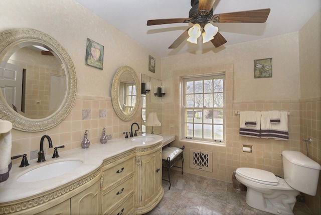 2221 Twin Oak Rd, Peru, IL 61354 - bathroom featuring tile walls, ceiling fan, toilet, double vanity, and a shower