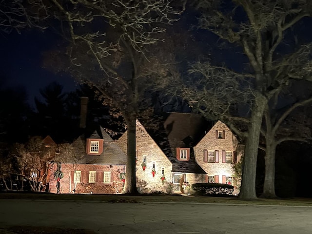 exterior space with stone siding
