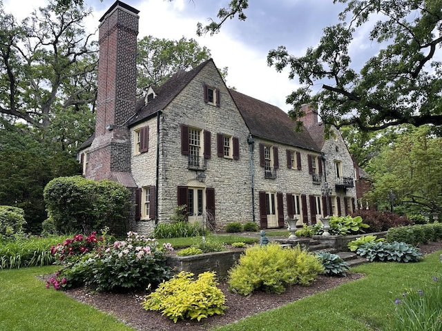 2221 Twin Oak Rd, Peru, IL 61354 - view of front facade with a chimney and stone siding