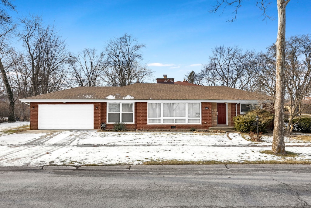 single story home with a garage