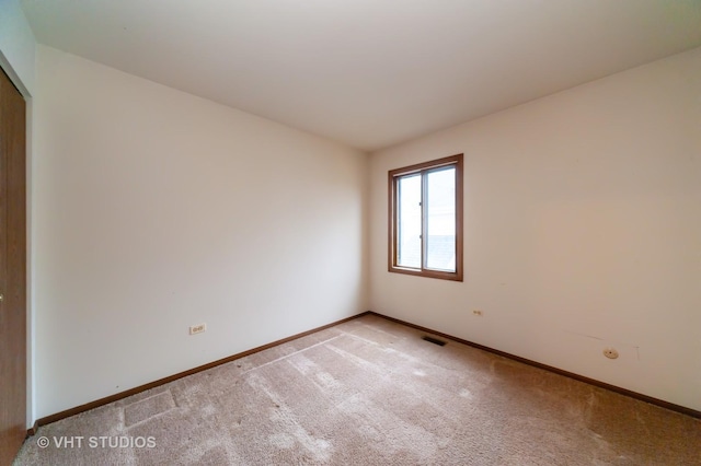 view of carpeted spare room