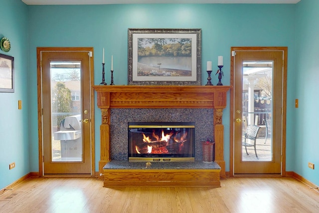 interior space with hardwood / wood-style flooring and a fireplace