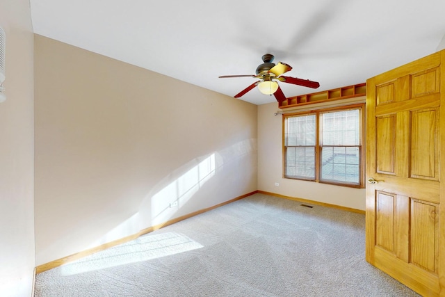 empty room with light carpet and ceiling fan