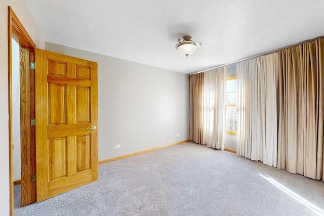 empty room with light colored carpet