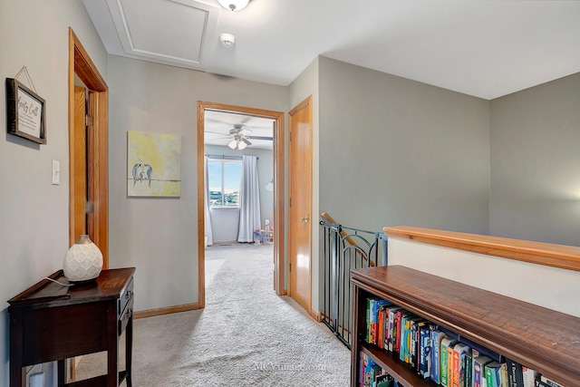 hallway with light carpet