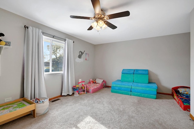 recreation room featuring ceiling fan and carpet flooring