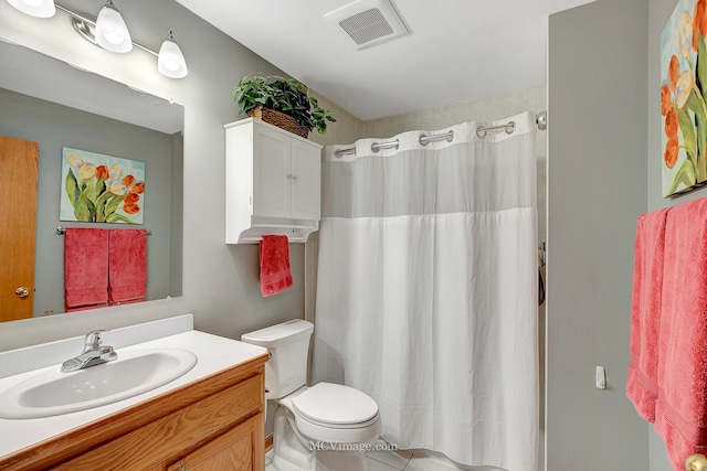 bathroom featuring vanity, toilet, and a shower with shower curtain