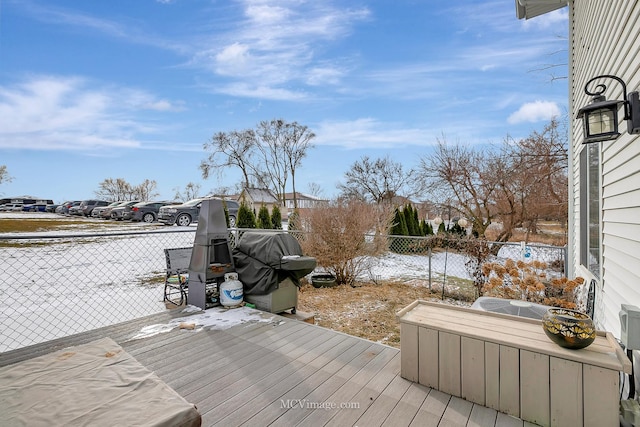 wooden deck with grilling area