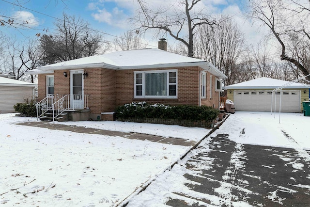 view of front of home featuring an outbuilding and a garage