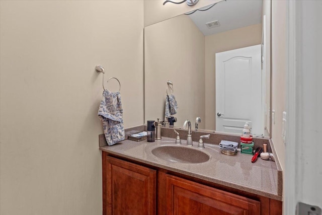 bathroom with vanity and visible vents