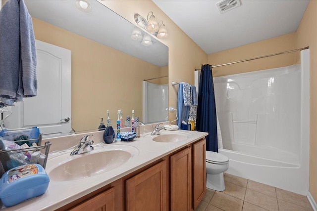 bathroom featuring a sink, tile patterned floors, shower / bath combination with curtain, and visible vents