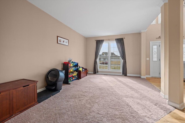 recreation room with carpet flooring and baseboards