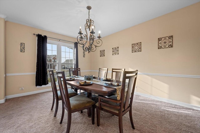dining area with carpet floors, baseboards, and a chandelier