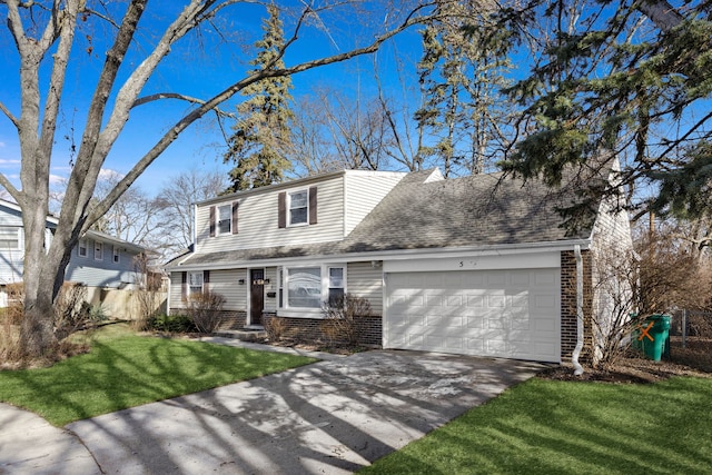 front of property with a garage and a front yard