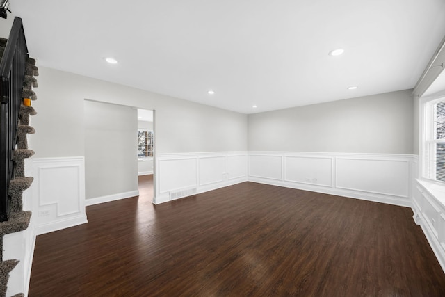 unfurnished room featuring dark hardwood / wood-style flooring