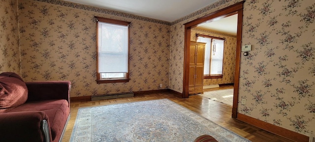 living area with parquet flooring and baseboard heating