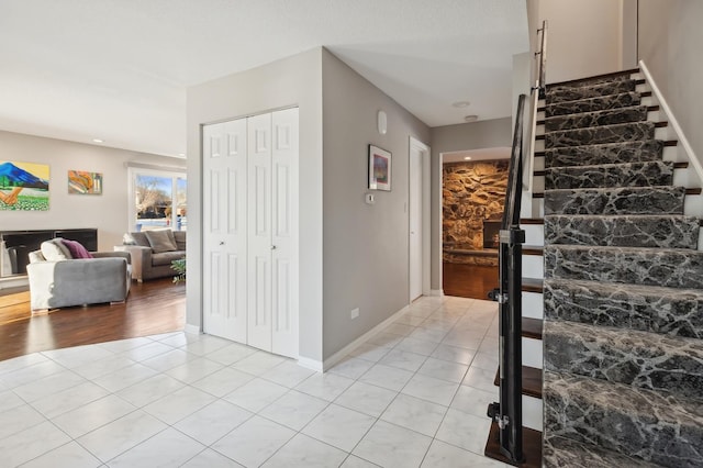 stairs featuring tile patterned floors