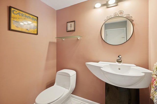 bathroom with toilet and sink