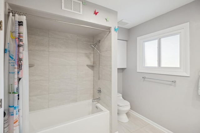 bathroom featuring shower / tub combo with curtain, toilet, and tile patterned flooring