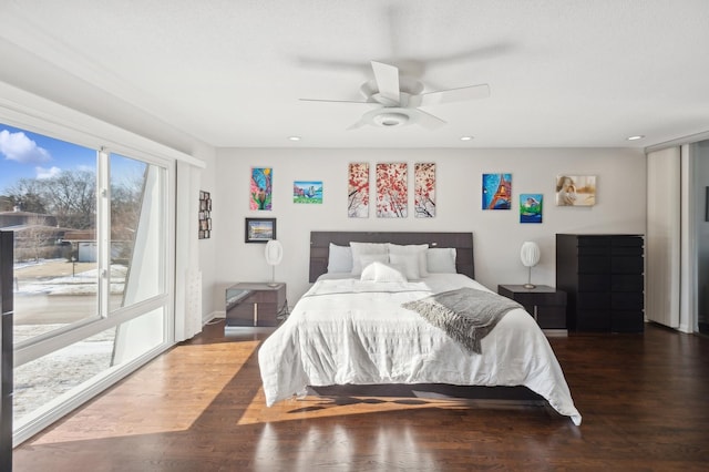 bedroom featuring dark hardwood / wood-style flooring and ceiling fan