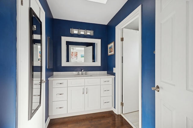 bathroom featuring vanity and hardwood / wood-style floors