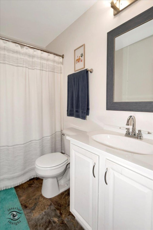 full bathroom with vanity and toilet