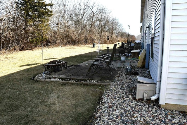 view of yard with an outdoor fire pit