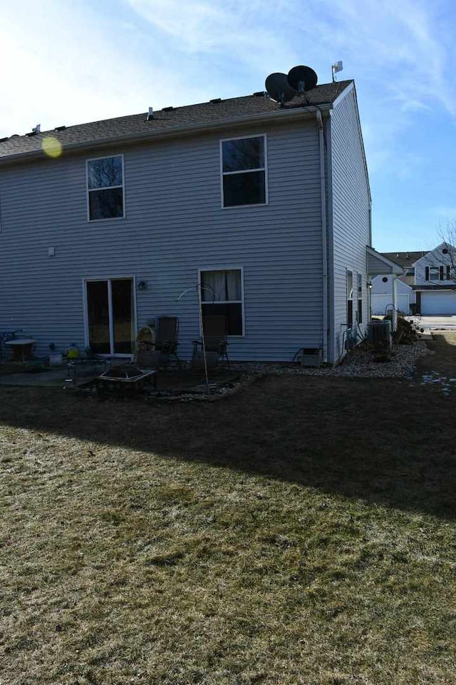 rear view of house with a lawn