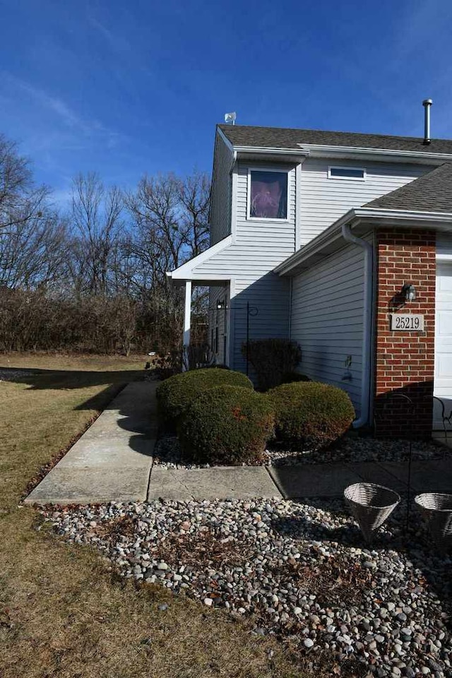 view of property exterior with a garage